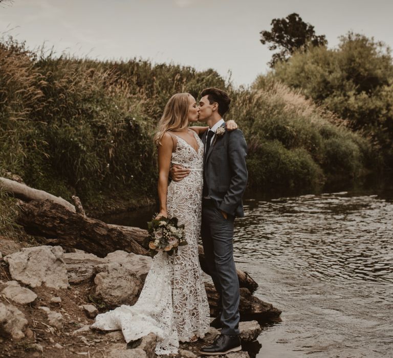 Bride in Sasha Dress by Made With Love with Crochet Finish, Fishtail Train, V-Neck and Plunging Back | Bridal Bouquet of Blush and White Roses, Gypsophila and Eucalyptus | Groom in Light Blue Two-Piece Suit by Hugo Boss | Blush Pink Buttonhole | Hessian Aisle | Hay Bales with White Blankets | Yurt Wedding with Outdoor Naked Tipi Ceremony, Glitter Station &amp; Peach Rewritten Bridesmaid Dresses | Nesta Lloyd Photography