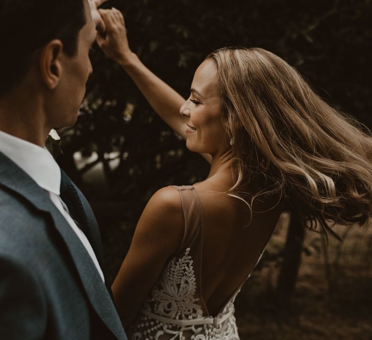 Bride in Sasha Dress by Made With Love with Crochet Finish, Fishtail Train, V-Neck and Plunging Back | Groom in Light Blue Two-Piece Suit by Hugo Boss | Yurt Wedding with Outdoor Naked Tipi Ceremony, Glitter Station &amp; Peach Rewritten Bridesmaid Dresses | Nesta Lloyd Photography