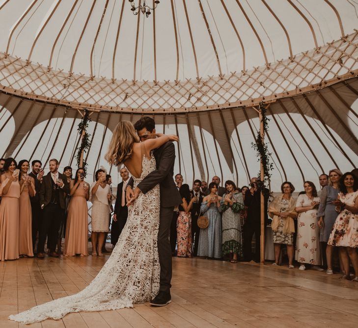 Bride in Sasha Dress by Made With Love with Crochet Finish, Fishtail Train, V-Neck and Plunging Back | Groom in Light Blue Two-Piece Suit by Hugo Boss | Bridesmaids in Mismatched Peach Rewritten Dresses, Tops and Skirts | First Dance in Yurt at Sychpwll Centre | Yurt Wedding with Outdoor Naked Tipi Ceremony, Glitter Station &amp; Peach Rewritten Bridesmaid Dresses | Nesta Lloyd Photography