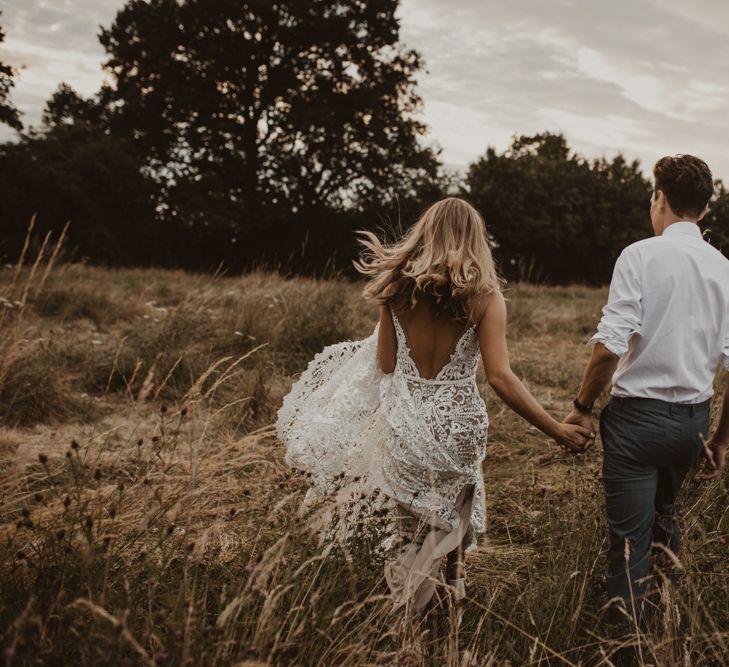 Bride in Sasha Dress by Made With Love with Crochet Finish, Fishtail Train, V-Neck and Plunging Back | Groom in Light Blue Two-Piece Suit by Hugo Boss | Yurt Wedding with Outdoor Naked Tipi Ceremony, Glitter Station &amp; Peach Rewritten Bridesmaid Dresses | Nesta Lloyd Photography