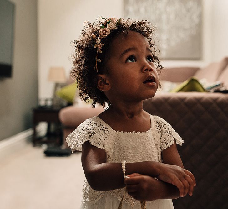 Flower girl with curly hair and Monsoon dress