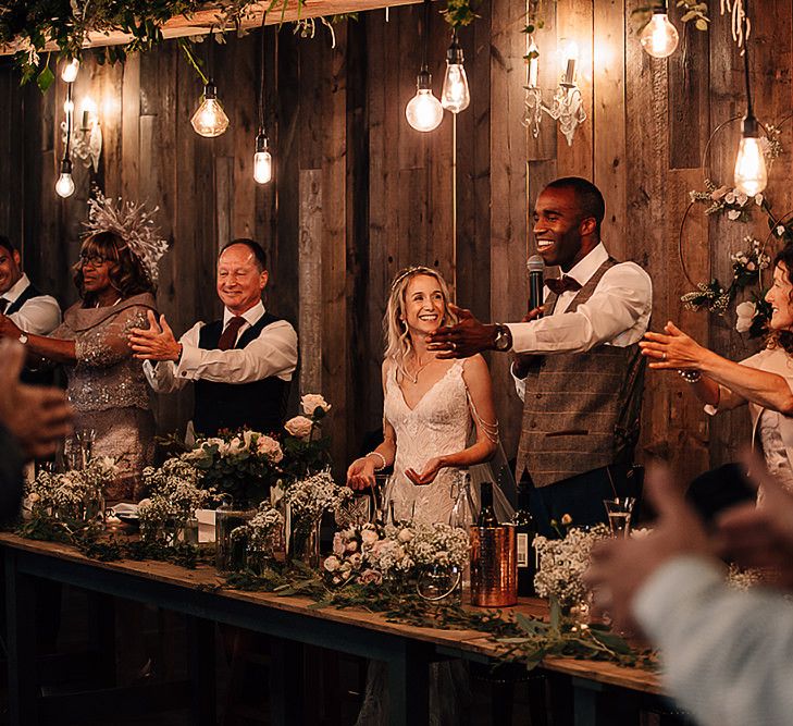 Wedding reception speeches at Wharfedale Grange with hanging festoon lights