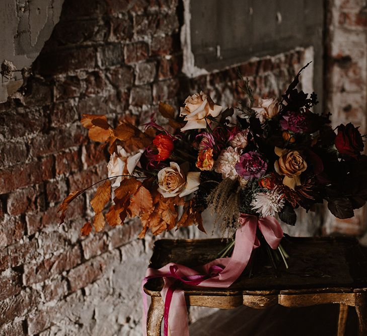 Deep Burgundy, Orange &amp; Pink Bridal Bouquet by Jenni Bloom Flowers | Deep Florals Wedding Inspiration at The Grange at Northington Planned &amp; Styled by Wed &amp; Bash | Sara Lincoln Photography