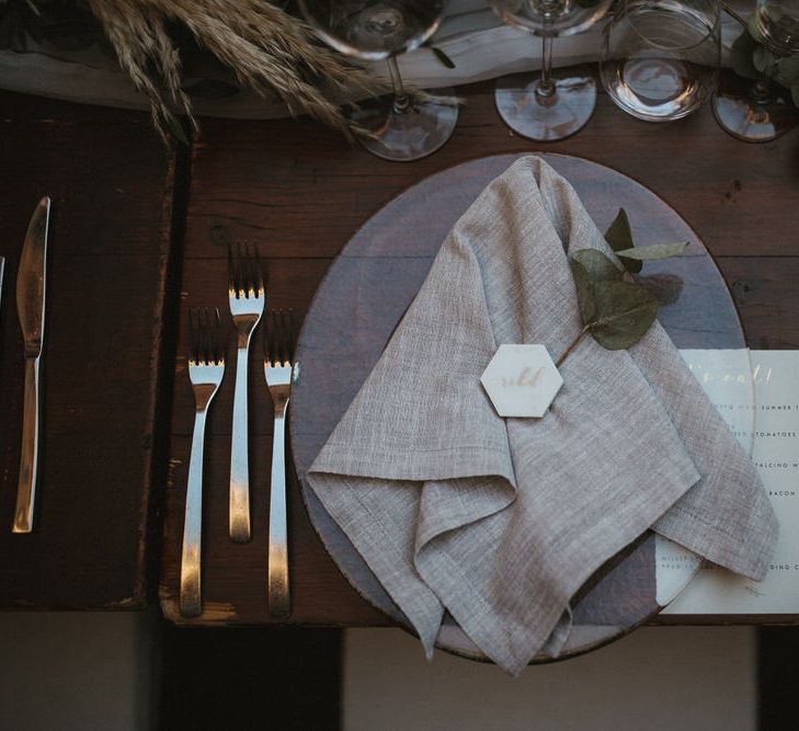 Geometric Marbled Place Name With Foliage Runner And Grey Linen Napkins // Image By James Frost Photography