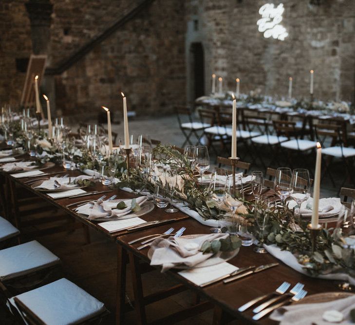 Ivory Tapered Candles With Foliage Runner And Grey Linen Napkins // Image By James Frost Photography