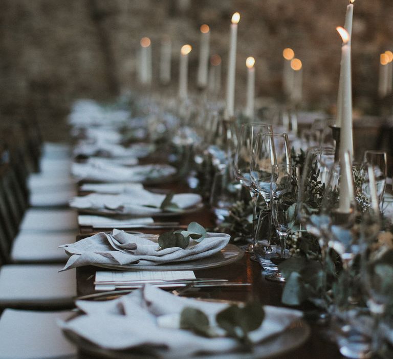 Ivory Tapered Candles With Foliage Runner And Grey Linen Napkins // Image By James Frost Photography