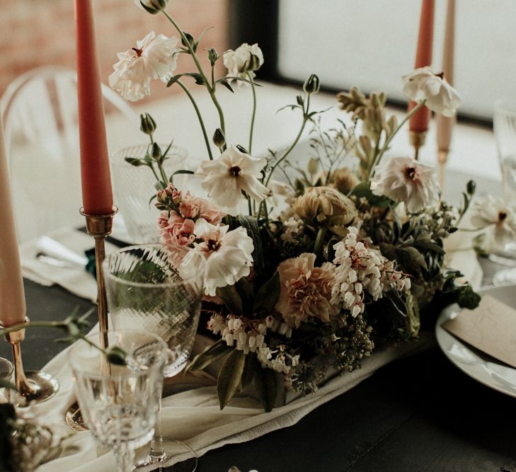 Delicate pink, white and green wedding flower centrepiece