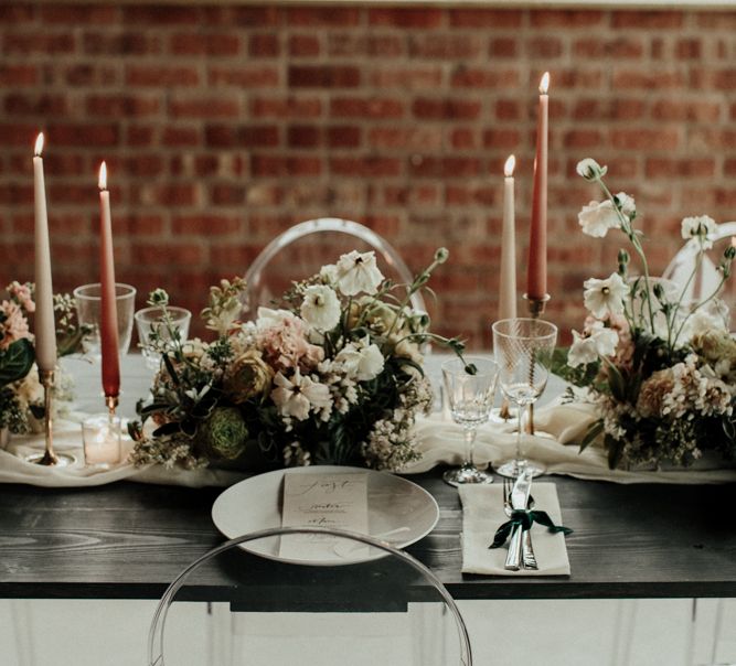 Muted pink and green wedding table decor and flowers and bridal crop top