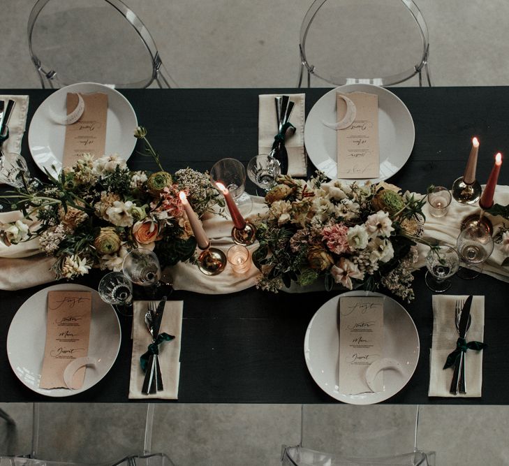 Intimate reception tablescape with flower and candle centrepiece decor