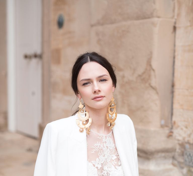 Stylish Bride in White Jacket, with Natural Makeup, Sleek Back Hair &amp; Statement Gold Earrings