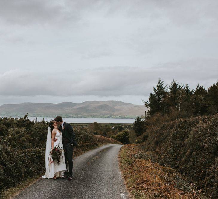 Bride in Elbeth Gillis Wedding Dress and Groom in  Tweed Suit