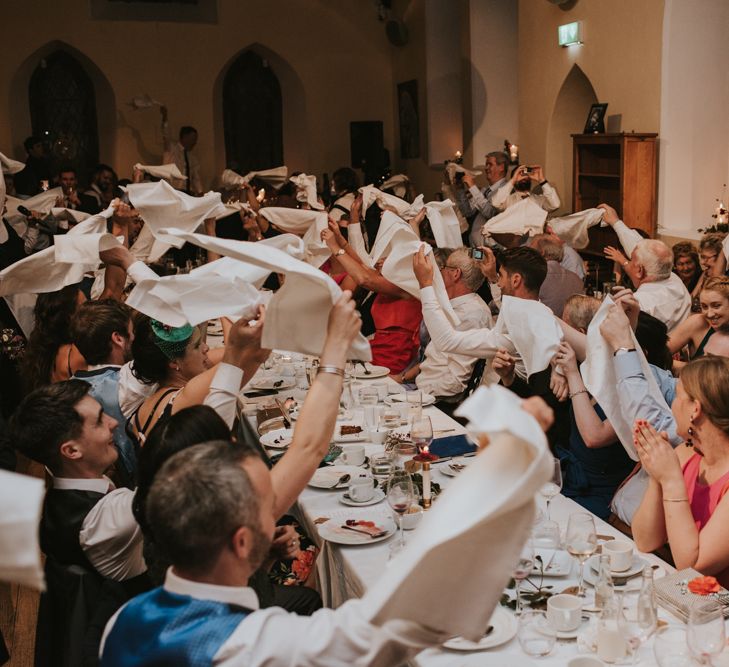 Wedding Guests Waving Their Napkins