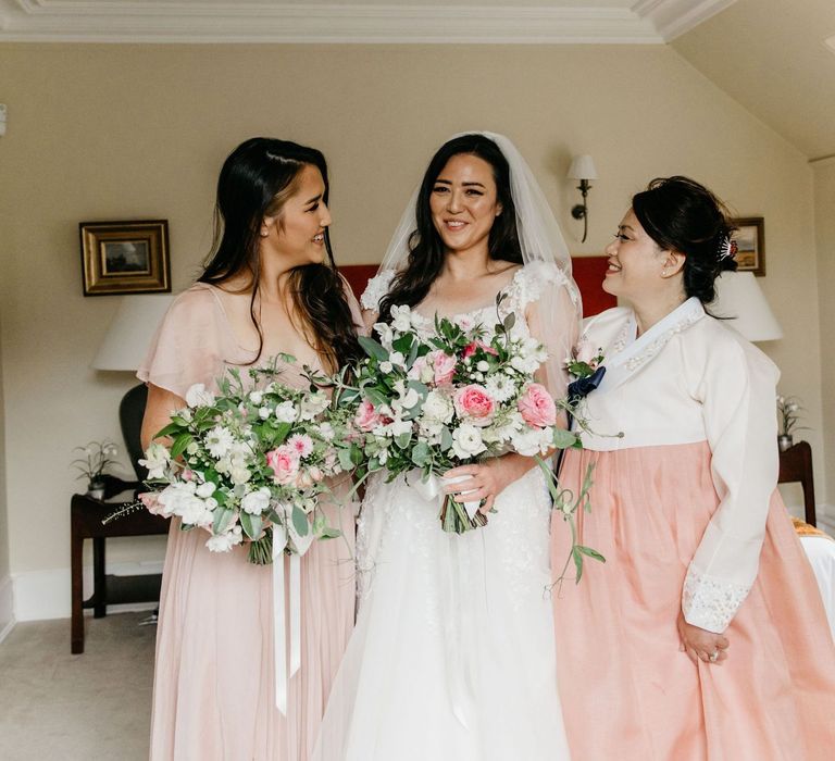 Bride with mother and sister on wedding morning