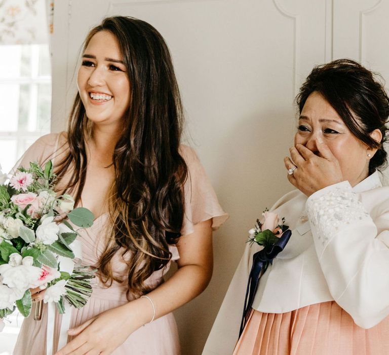 Emotional mother of the bride on the wedding morning