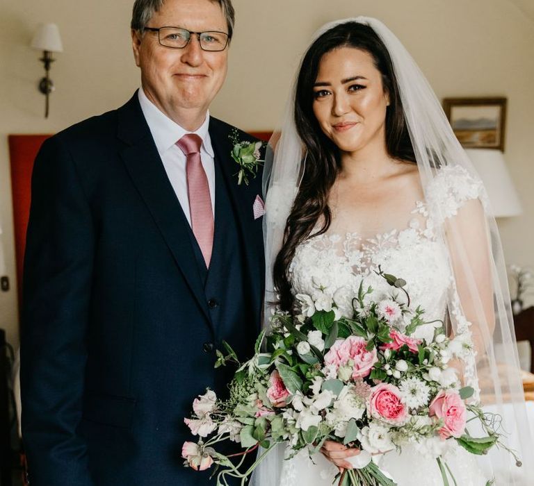 Father of the bride and daughter on the wedding morning