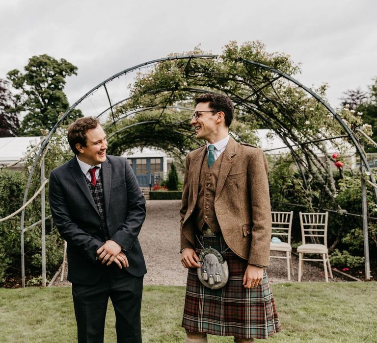 Groom and groomsmen before the socially distanced wedding ceremony