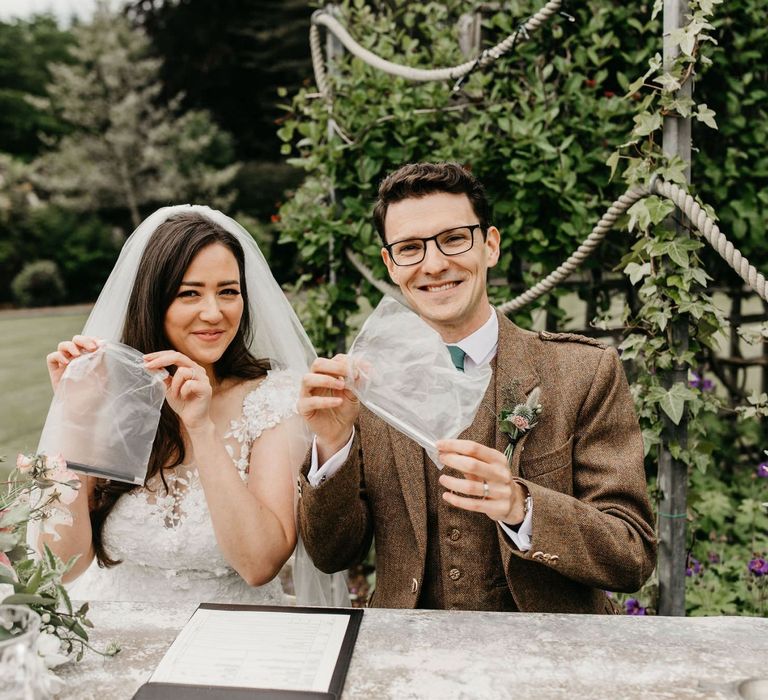 Individual pens to sign the register at post COVID wedding ceremony