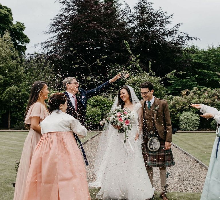 Confetti moment at Elsick House with Korean wedding dress