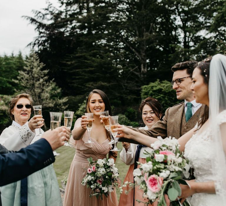 Champagne toast at socially distanced wedding