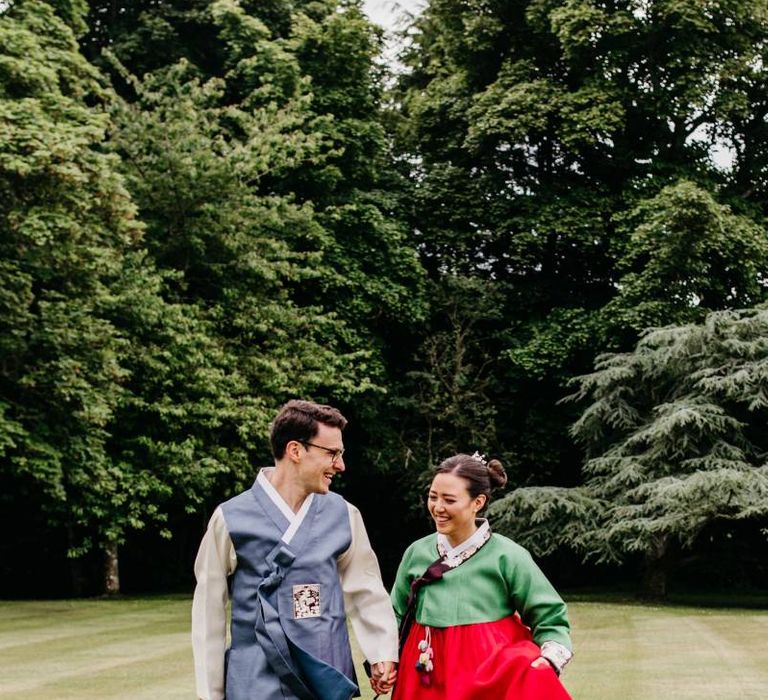 Bride and groom in tailor made Korean wedding dress