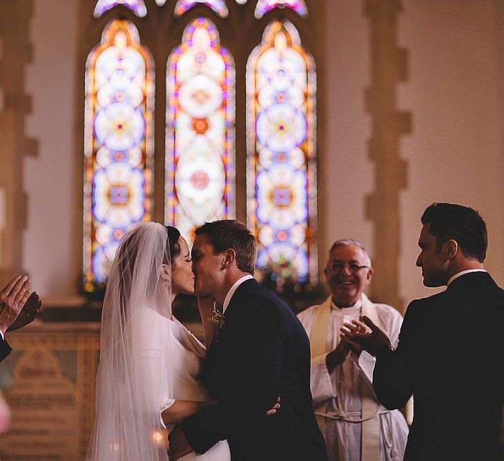 Bride and groom say 'I Do' at church ceremony