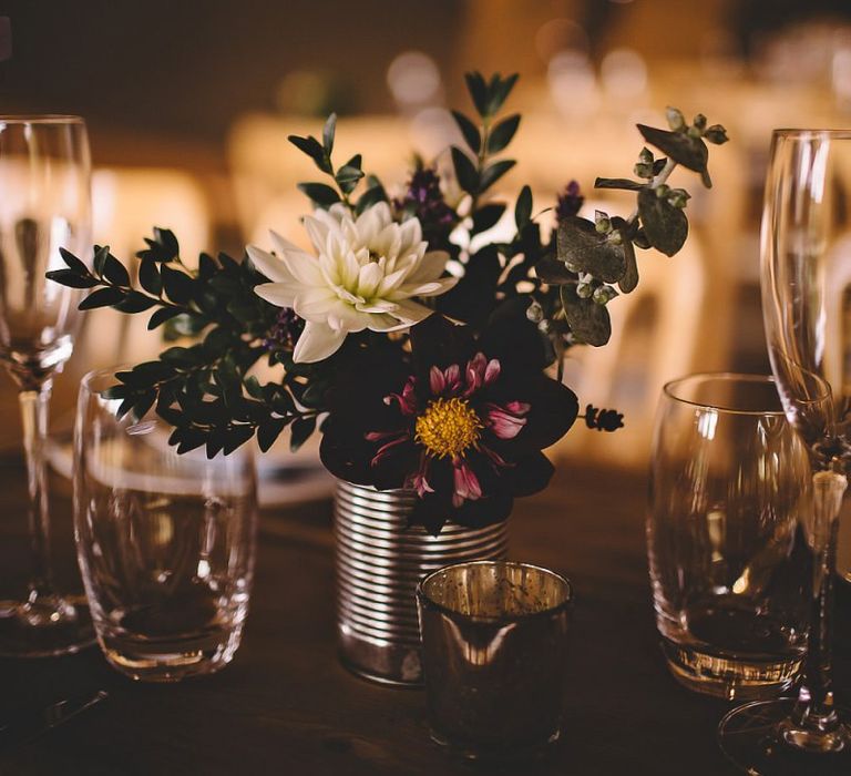 Wild meadow styled home-grown flowers for table arrangements at summer reception