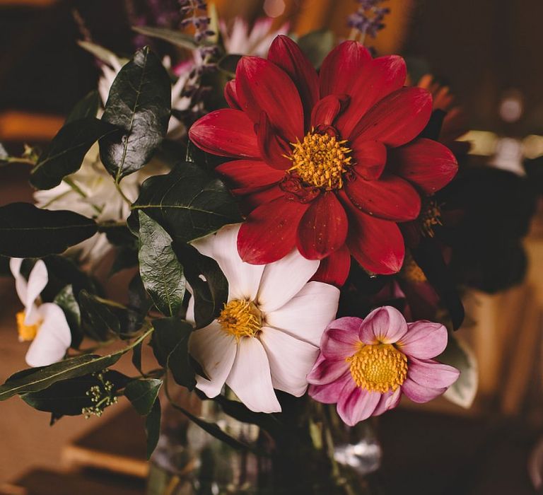 Wild meadow styled home-grown flowers for table arrangements at summer reception