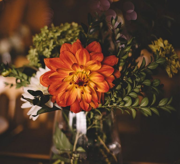 Wild meadow styled home-grown flowers for table arrangements at summer reception