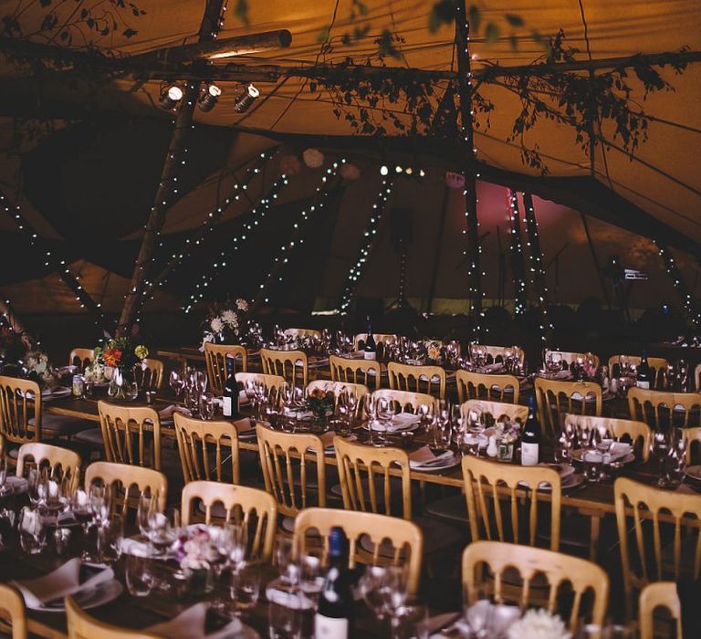 Garden party tipi reception in August with home-grown flower decor and rustic styling