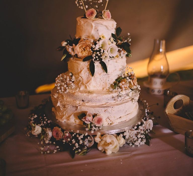 Beautiful wedding cake with white and pink rose decor