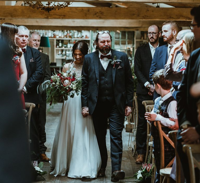 Wedding Ceremony Bridal Entrance with Bride Walking Down the Aisle in Maggie Sottero Wedding Dress