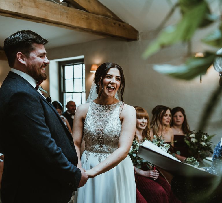 Bride in Halterneck Maggie Sottero Wedding Dress and Groom in Suit &amp; Bow Tie