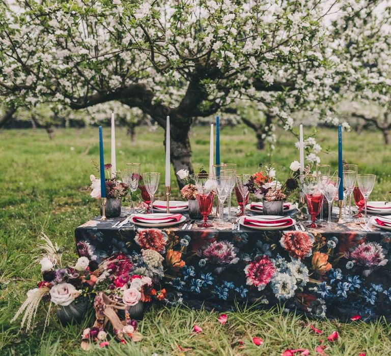 Vibrant Floral Tablescape with Taper Candles and Plush Napkins