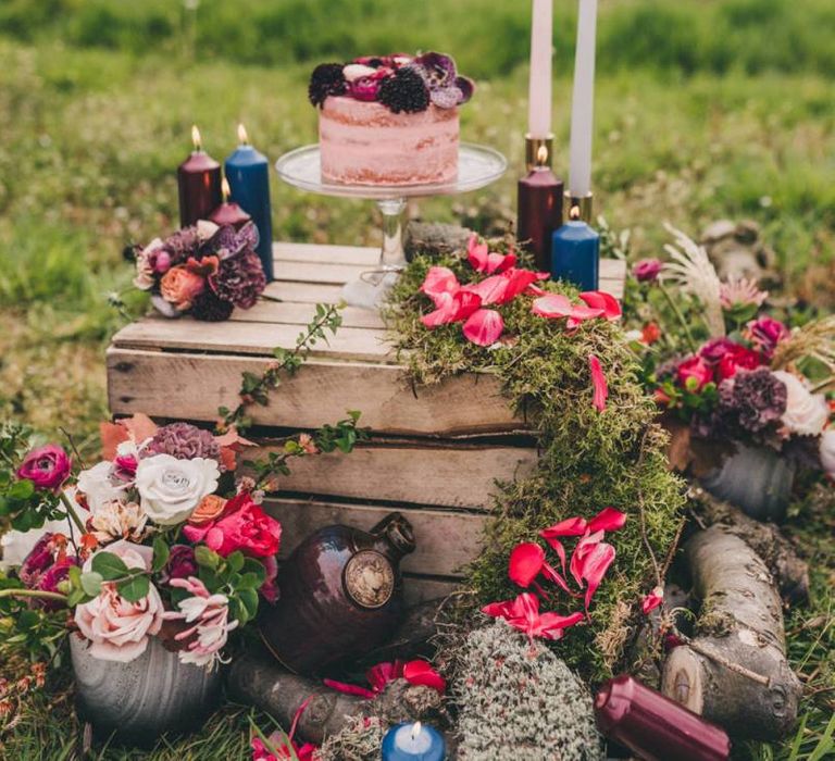 Wedding Cake Display with Rustic Crate, Coloured Candles and Flowers