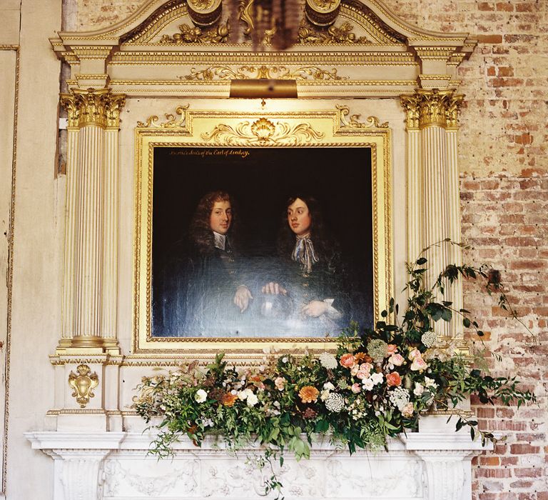 Living Coral, White &amp; Greenery Fireplace Mantel Wedding Flowers | Elegant Summer Inspiration at St Giles House, Dorset by Jessica Roberts Design   Imogen Xiana Photography