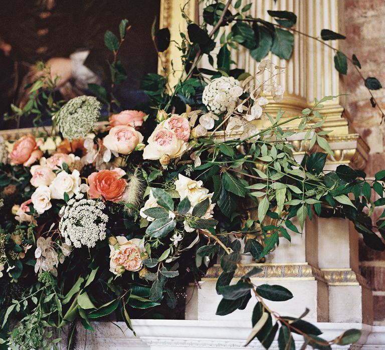 Living Coral, White &amp; Greenery Fireplace Mantel Wedding Flowers | Elegant Summer Inspiration at St Giles House, Dorset by Jessica Roberts Design   Imogen Xiana Photography