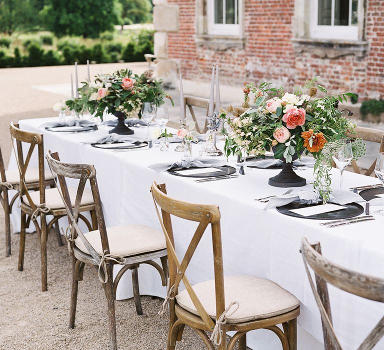 Outdoor Tablescape with Living Coral, White &amp; Greenery Floral Centrepieces | Elegant Summer Inspiration at St Giles House, Dorset by Jessica Roberts Design   Imogen Xiana Photography