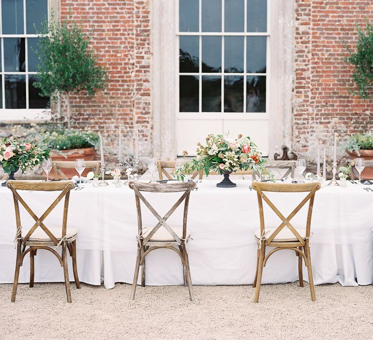 Outdoor Tablescape with Living Coral, White &amp; Greenery Floral Centrepieces | Elegant Summer Inspiration at St Giles House, Dorset by Jessica Roberts Design   Imogen Xiana Photography