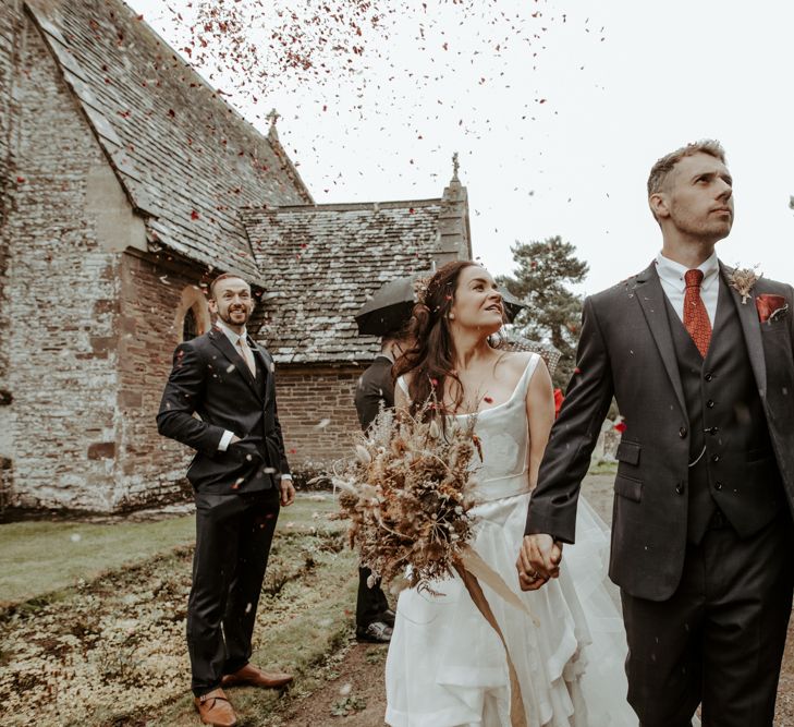 Bride and groom in the churchyard at September 2020 wedding