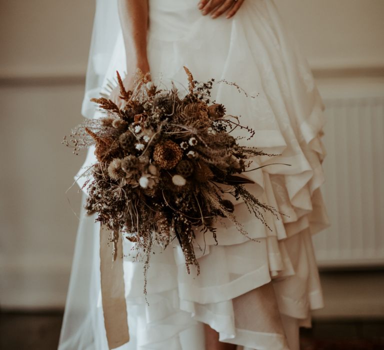 Dried flower wedding bouquet and high and low wedding dress