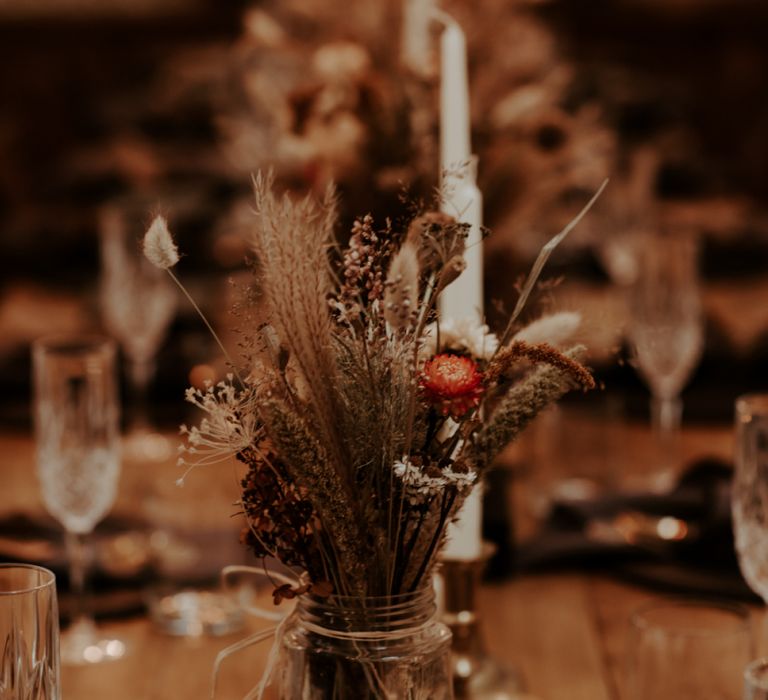 Dried flowers and grasses in jars for September 2020 wedding