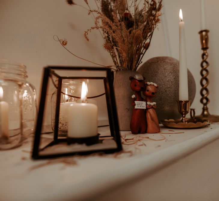 Candles and wooden figures for September 2020 wedding