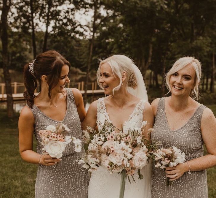 Bridesmaids in grey beaded dresses