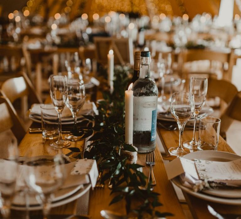 Wedding table decor with foliage and candles