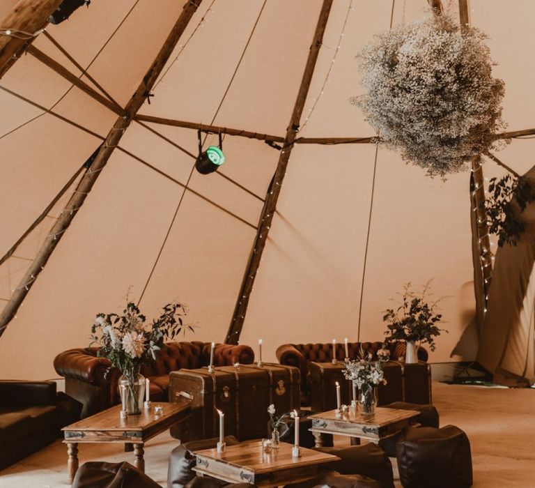 Teepee for wedding reception with seating area