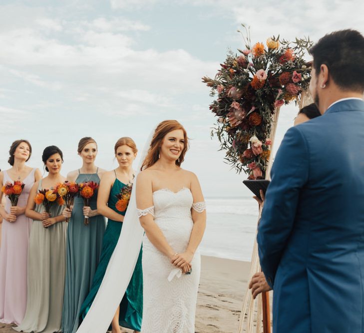 Bride and Groom With Bridesmaids wearing Colourful Dresses