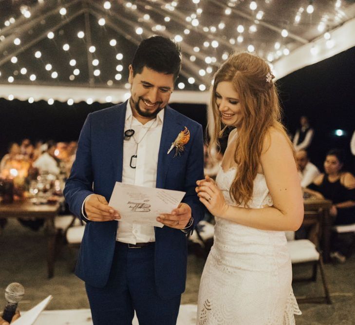 Bride and Groom Enjoy Reading Guests Notes