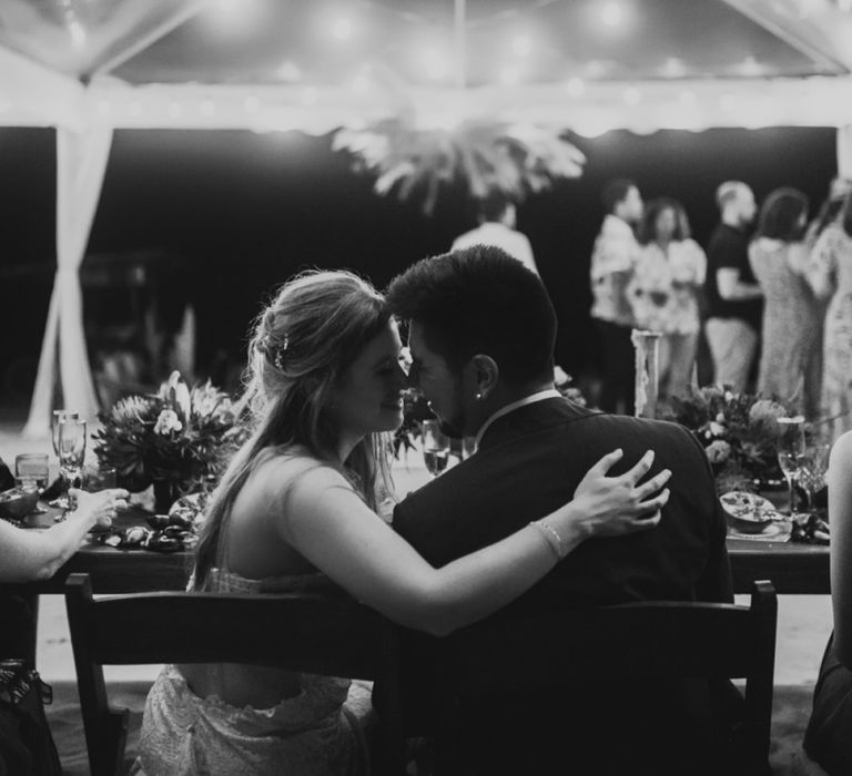 Bride and Groom Share a Kiss During Reception