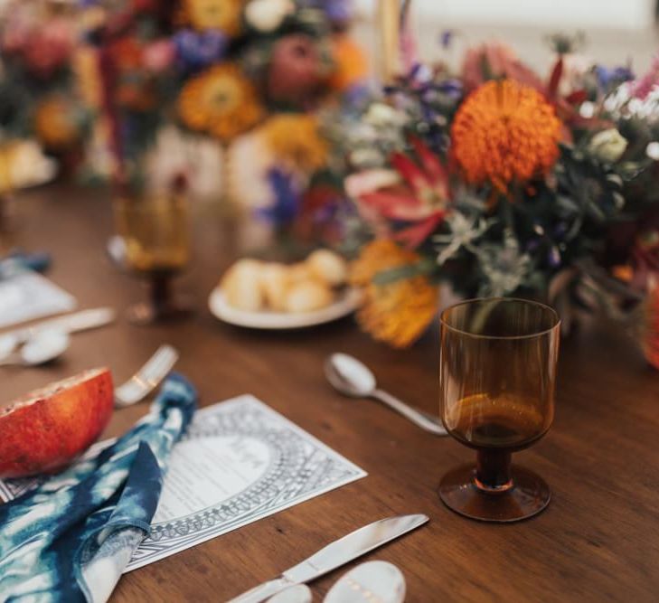 Table Place Setting with Orange and Red Flowers