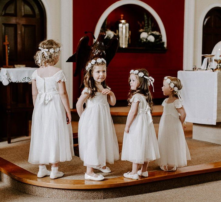 Flower girls in white dresses for wedding in Ireland